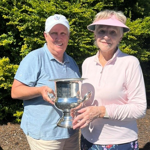Carole Stone receiving the Mary Lou Crowder Trophy from Kathy Cuppia
